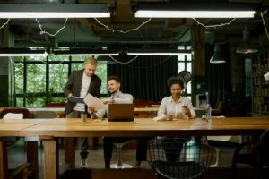 Business team talking, working together at coworking office open space