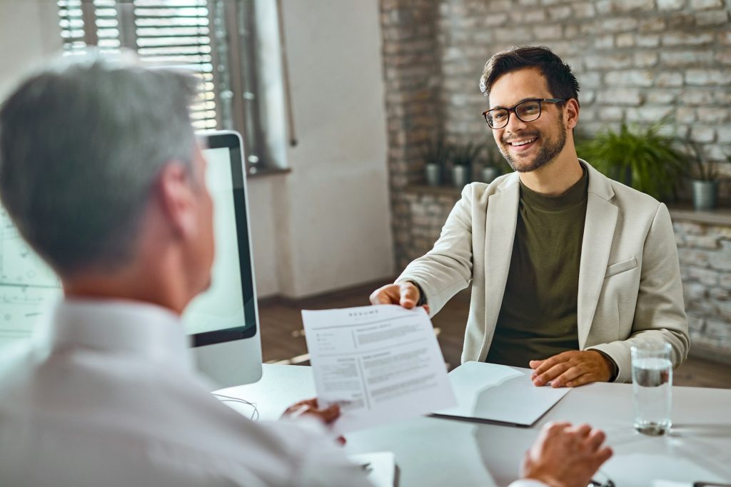 FBI candidate giving his resume on a job interview in the office.